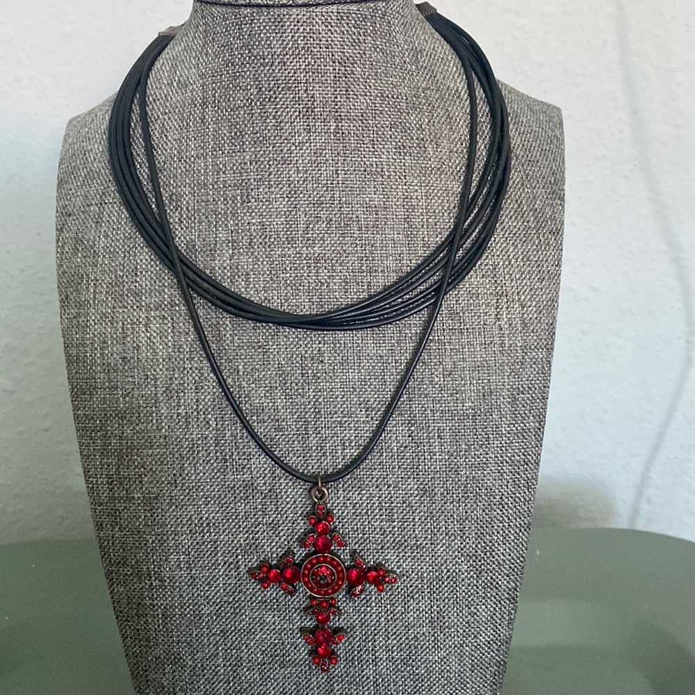 Red beaded cross on faux leather look strand